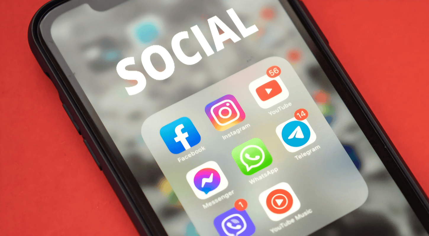 Smartphone screen displaying social media app icons including Facebook, Instagram, YouTube, Messenger, WhatsApp, Telegram, and YouTube Music, highlighting social networking and communication tools.